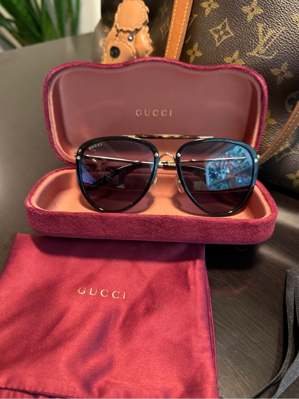 Gucci unisex Black and Gold Aviator Sunglasses